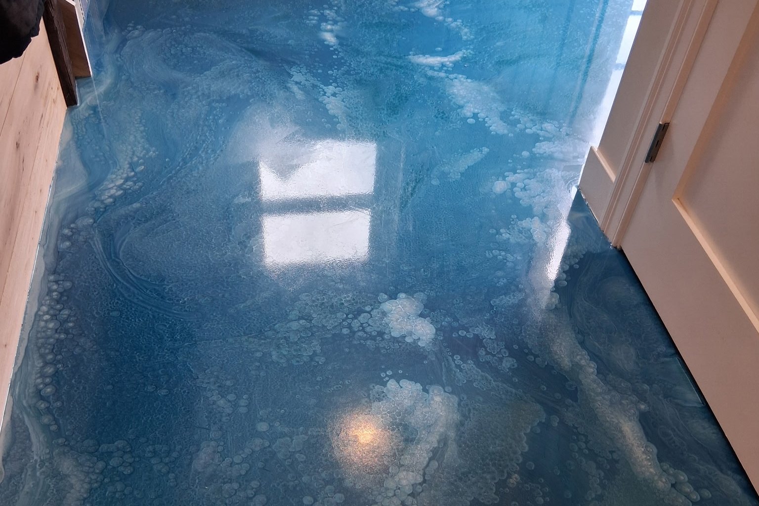 A poured metallic floor showing movement in the pigment