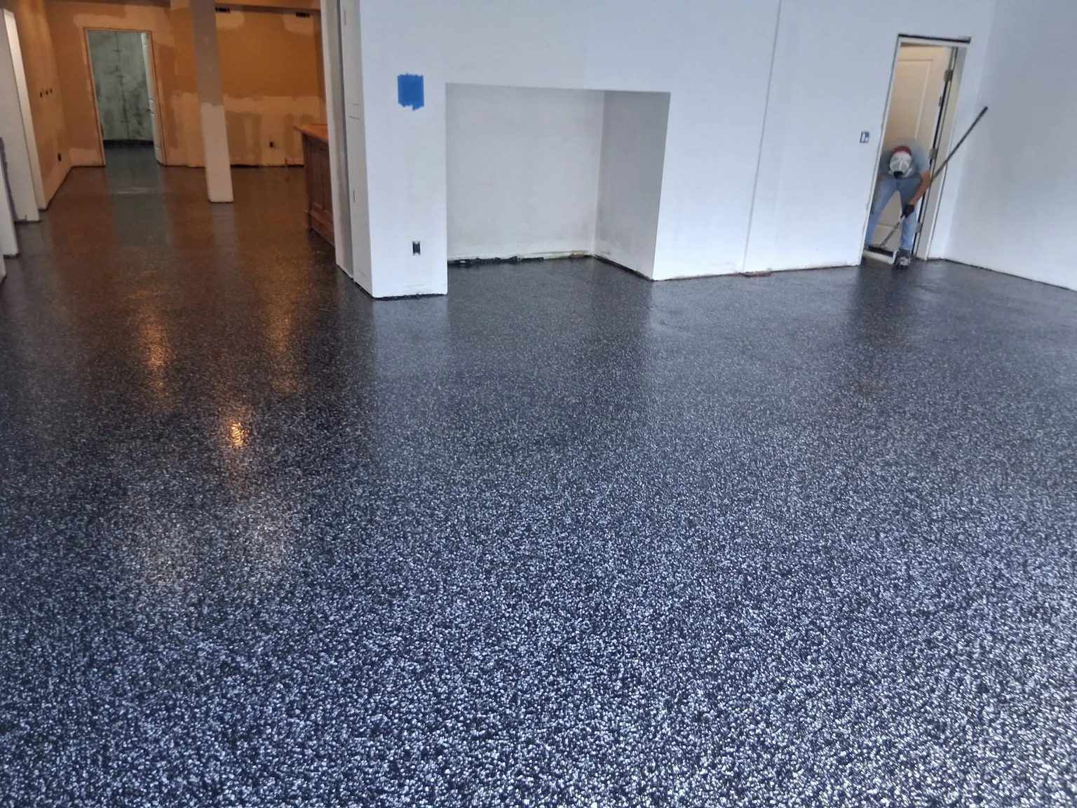 A finished flake floor running through into the next room